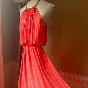Long flowing dress. You can dress up or do casual summer outings in.